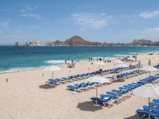 Medano Beach Filled with chairs in Front of Riu Santa Fe