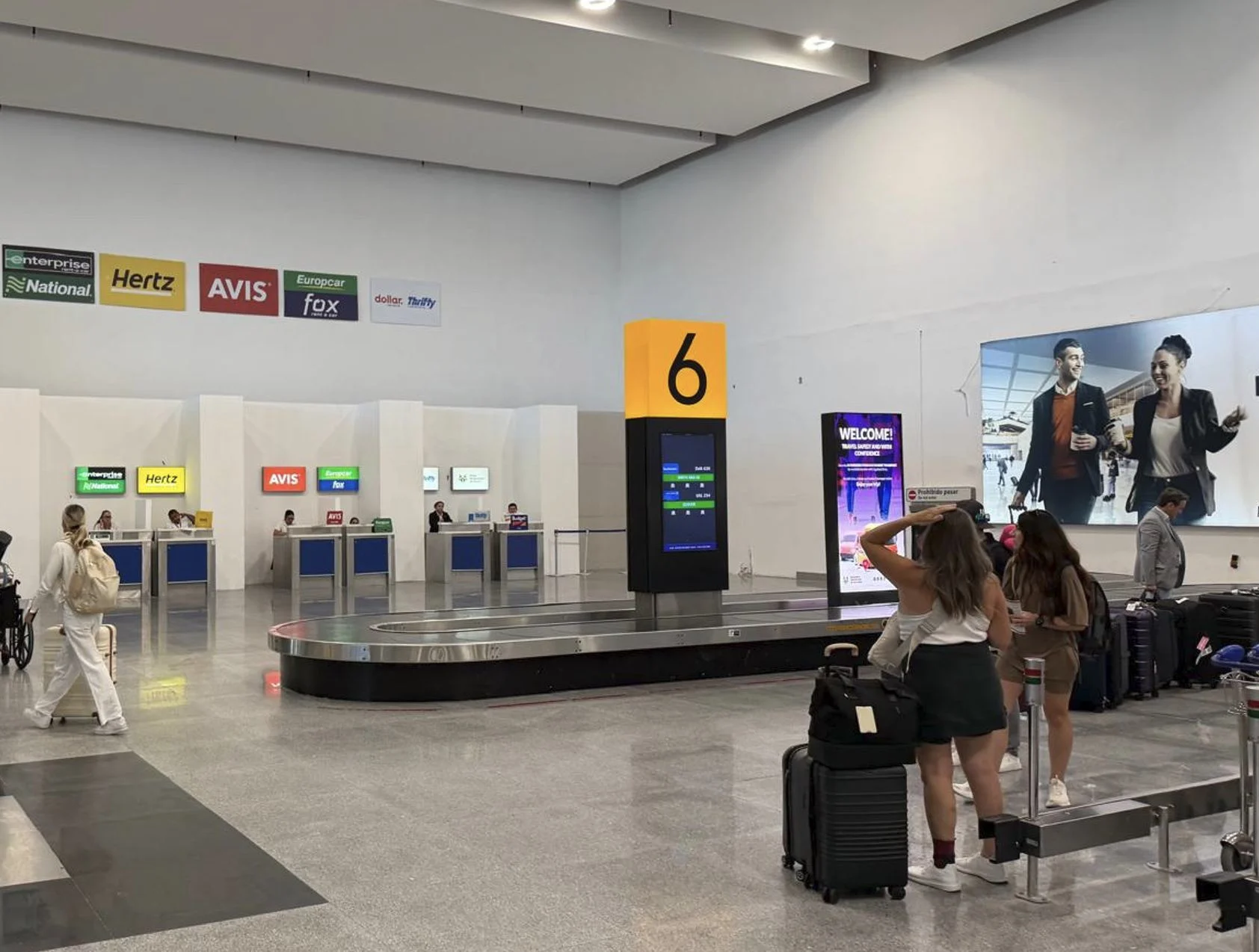 Baggage Lugguge claim airport travelers with suitcase