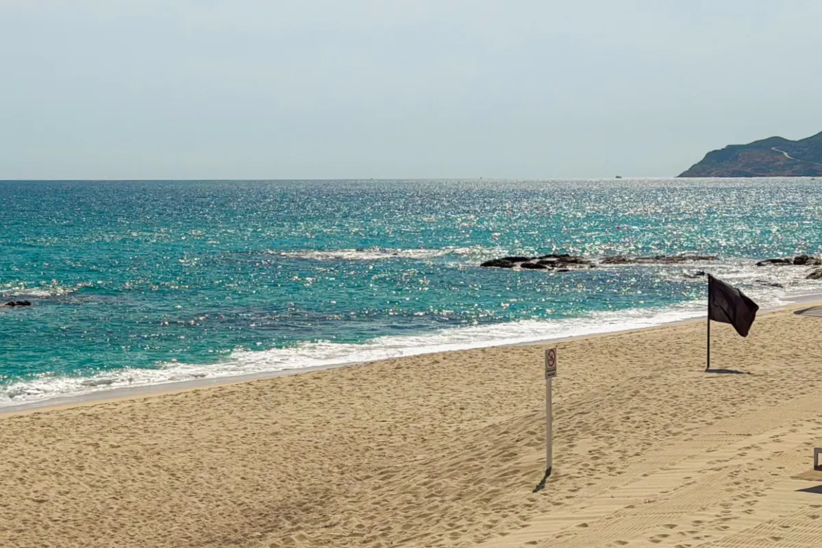 Tourist Corridor Beach with Black Flag Flying on a Sunny Day when the waves look calm