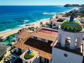 Aerial view of Hacienda del Mar with beach and ocean