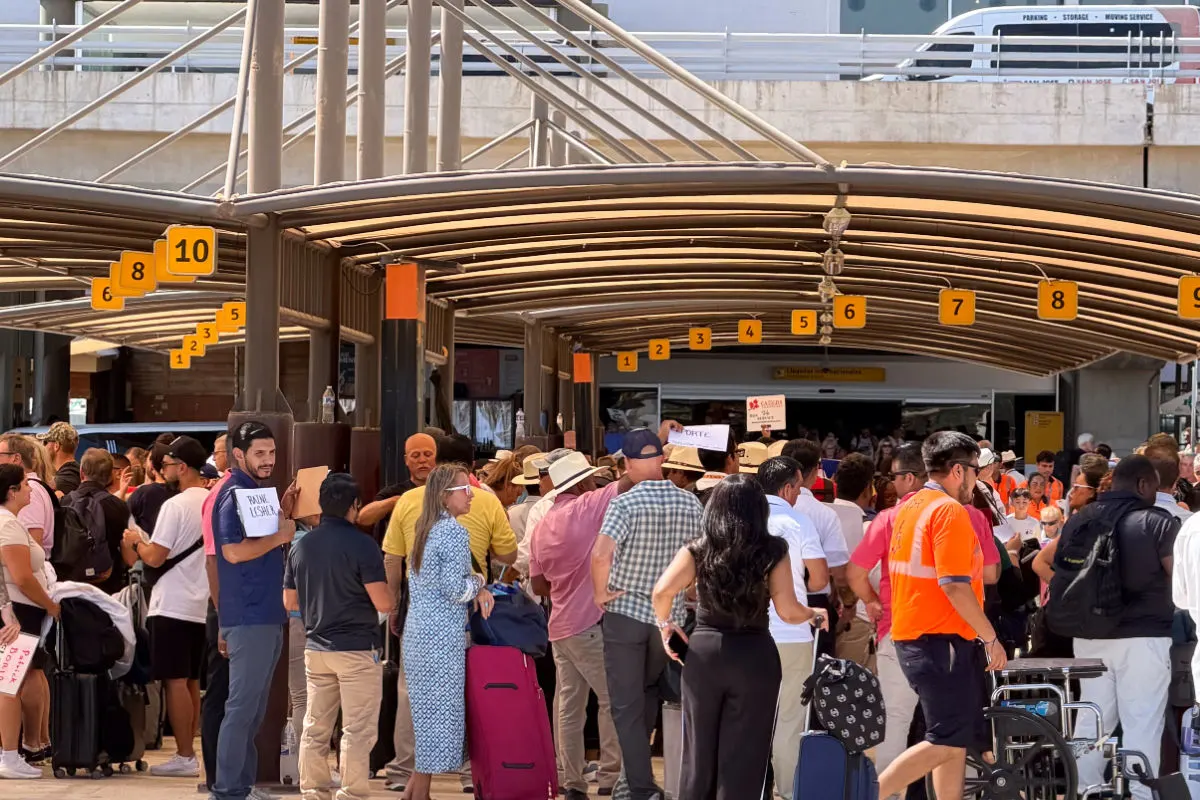 Busy scene with tourists at the pick up area at Los Cabos International Airport