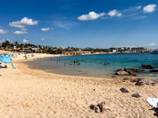Chileno Beach in Los Cabos with people enjoying the beach and swimming