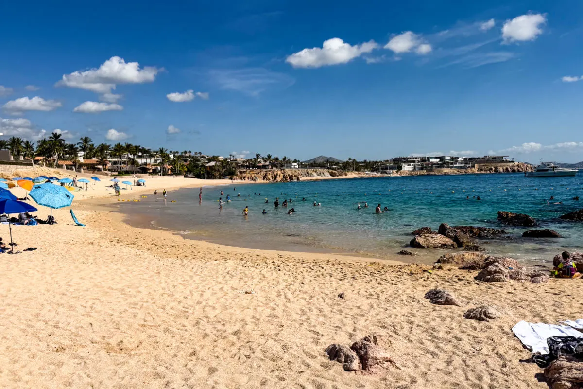Chileno Beach in Los Cabos with people enjoying the beach and swimming