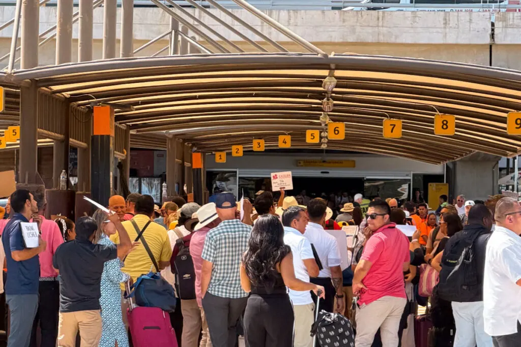 Loading area outside of the Los Cabo Airport with transportation providers waiting at bays