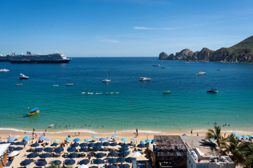 View overlooking Medano beach and the arch with tour options below