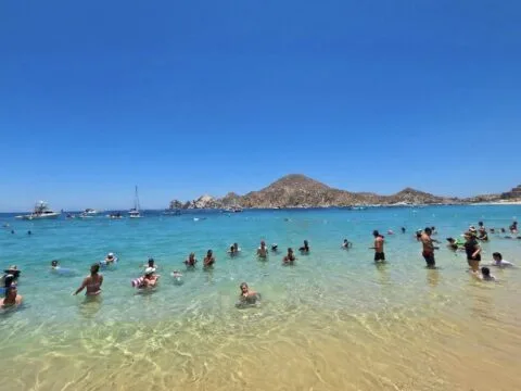 Travelers Swimming at Medano Beach In Los Cabos Original Photo By Trevor Kucheran