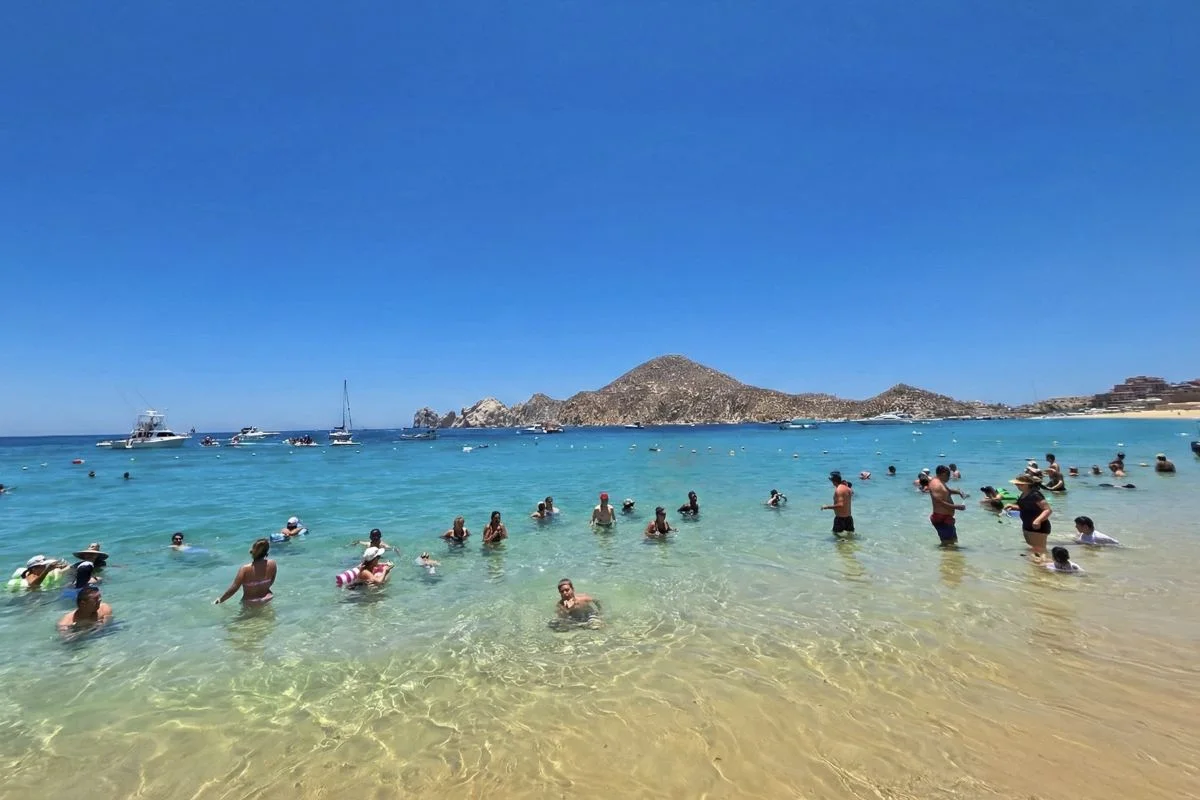 Travelers Swimming at Medano Beach In Los Cabos Original Photo By Trevor Kucheran