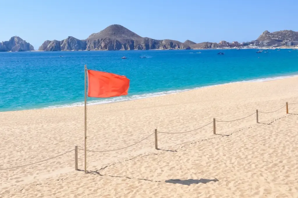 Red-Beach-Warning-Flag-in-Cabo-San-Lucas-Mexico