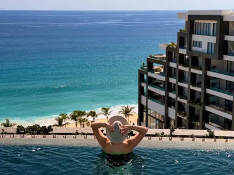 Woman in the rooftop pool at Garza Blanca Los Cabos