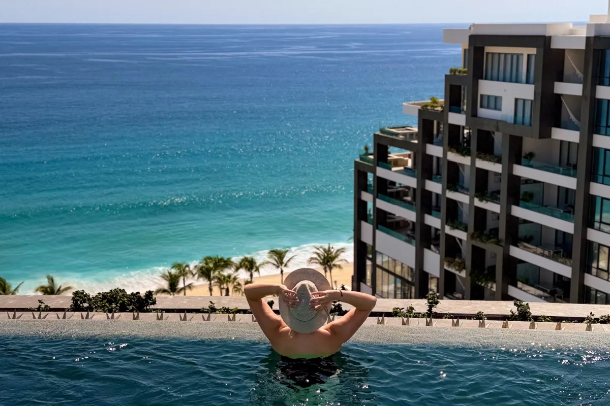 Woman in the rooftop pool at Garza Blanca Los Cabos