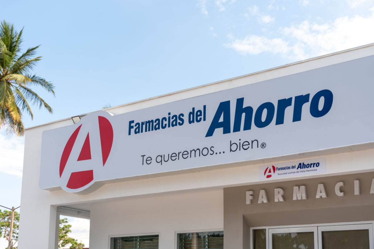 Facade of Farmacia del Ahorro with distinctive red and blue sign, exterior view of building in urban area and main entrance visible pharmacy