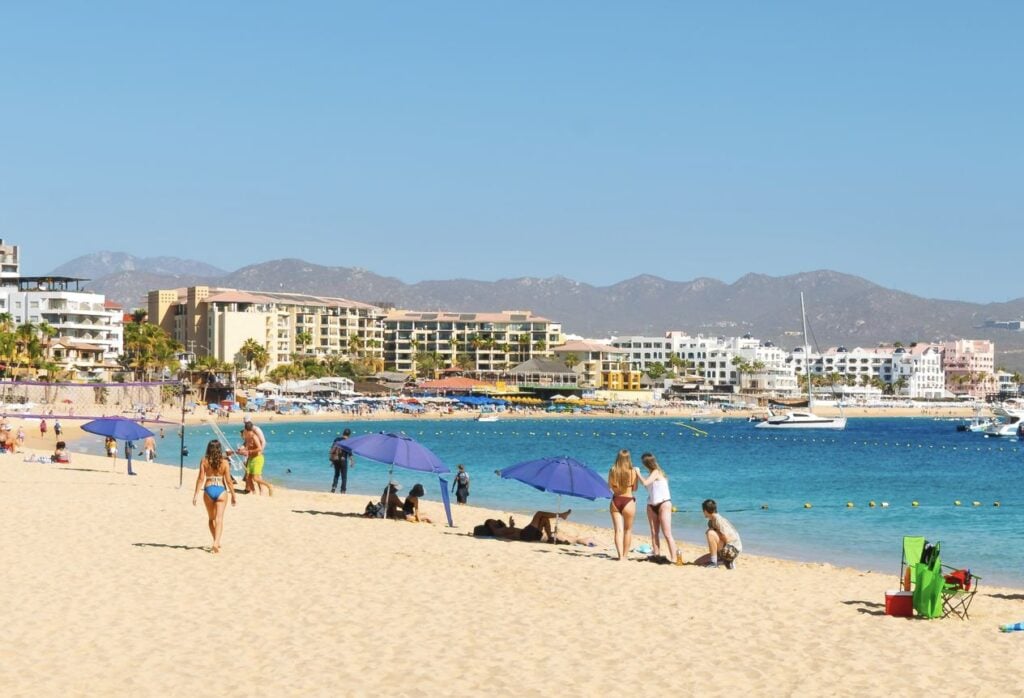 American travelers on Medano beach enjoying vacation